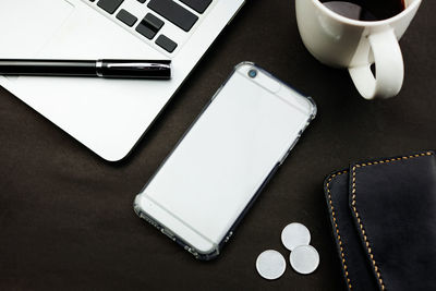 High angle view of coffee cup on table