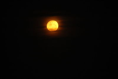 Low angle view of moon against sky at night