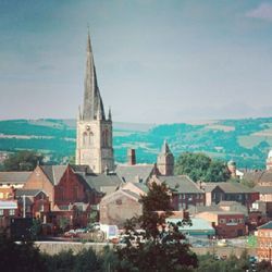 View of cityscape against blue sky