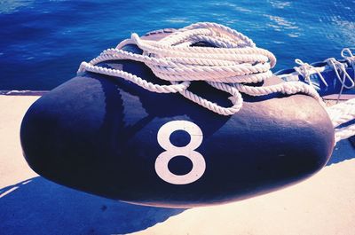 Close-up of rope against blue sea