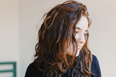 Close-up of young woman with brown hair