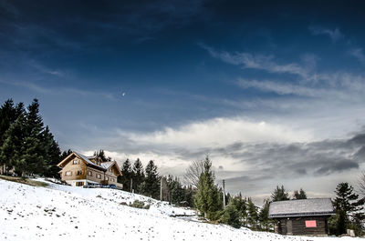 View of church against cloudy sky during winter