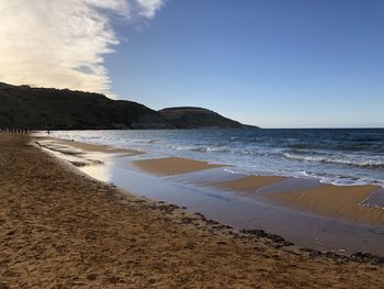 Scenic view of beach against sky