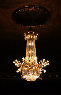 Low angle view of illuminated lanterns hanging at night