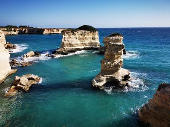 Scenic view of sea against blue sky