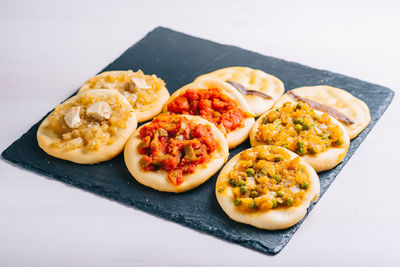 High angle view of pizza served on table