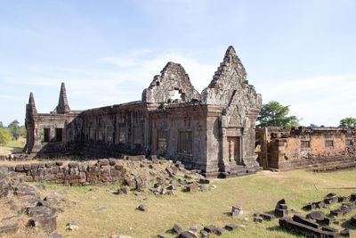 Old temple against cloudy sky