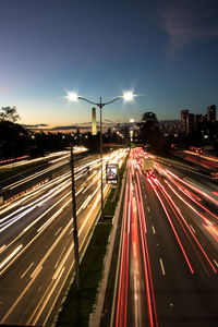 High angle view of light trails on highway at night