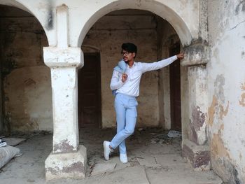 Full length of man standing in building