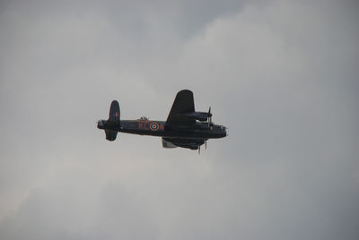 Low angle view of airplane against sky