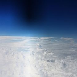 Scenic view of landscape against blue sky