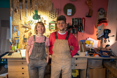 Portrait of female friends standing at home