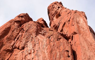 Low angle view of rock formations against sky