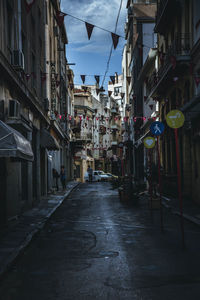 Narrow alley amidst buildings in city