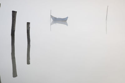 Wooden ship behind the fog