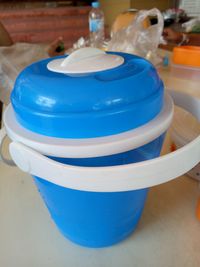 Close-up of blue cup on table