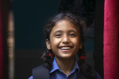 Portrait of smiling girl at home