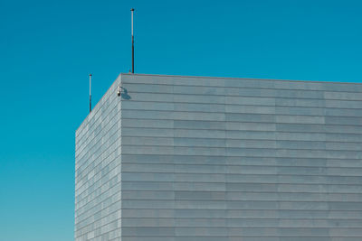 Low angle view of building against clear blue sky