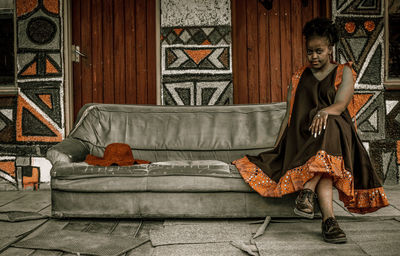 Wide shot of model with red and black dress