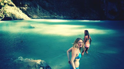 Women wearing bikini in river