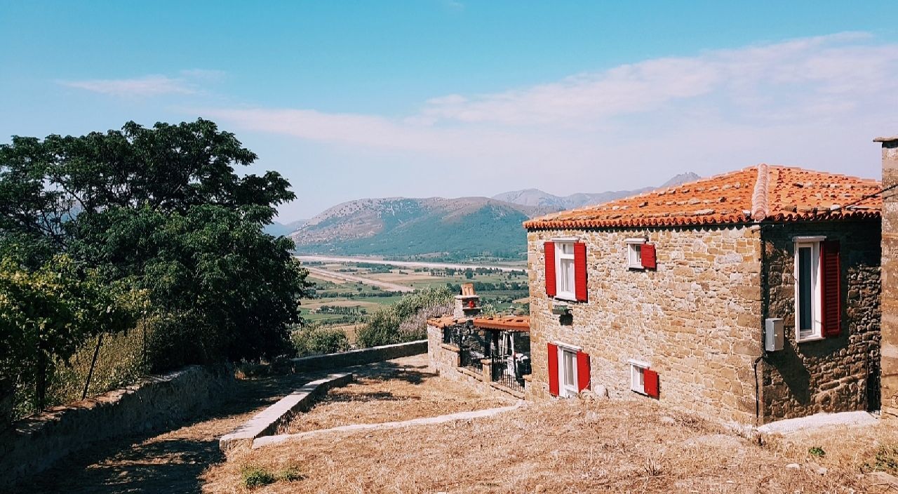 mountain, architecture, built structure, sky, building exterior, plant, tree, nature, landscape, cloud - sky, day, building, no people, mountain range, environment, house, residential district, rural scene, beauty in nature, land, outdoors