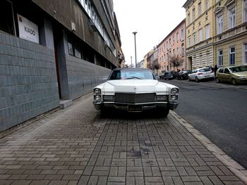 Car parked on street by building