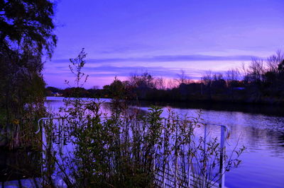 Scenic view of lake at sunset