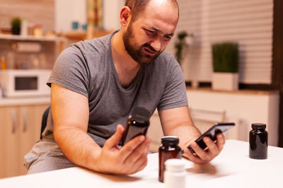 Portrait of man using mobile phone