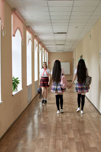 High school student is walking down the corridor of the school. anime style