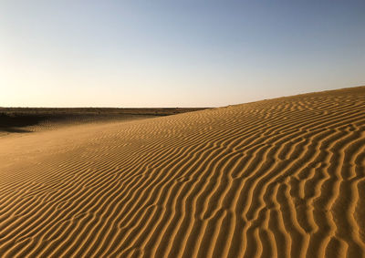 Scenic view of desert against clear sky