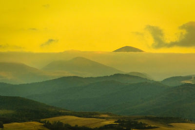 Scenic view of mountains against sky during sunset