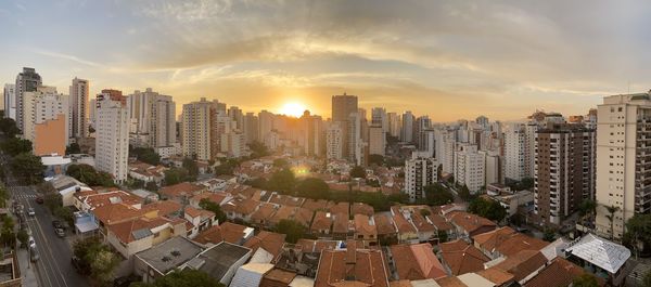 High angle view of buildings against sky during sunset