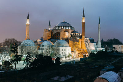 View of illuminated buildings against sky