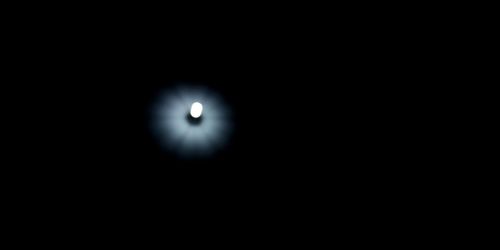 Low angle view of moon against dark sky