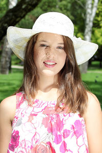 Portrait of beautiful young woman in hat