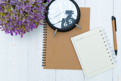 High angle view of clock on table