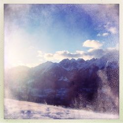 Scenic view of mountains against sky during winter