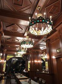 Low angle view of illuminated lanterns hanging at night