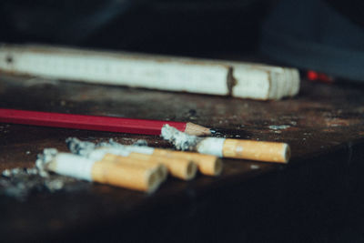 Close-up of cigarette on table