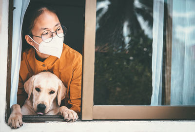 Portrait of young woman with dog