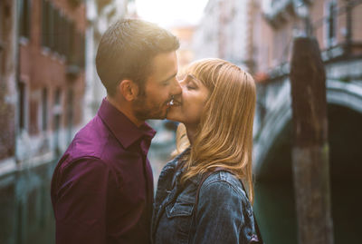 Young couple kissing outdoors