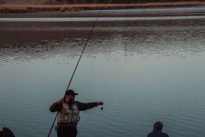 High angle view of man fishing in lake