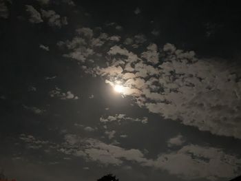 Low angle view of sun shining in sky