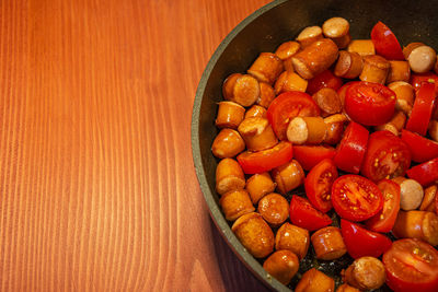 High angle view of chopped fruits in bowl on table