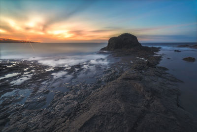 Scenic view of sea against sky during sunset