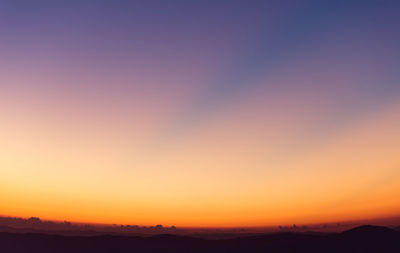 Scenic view of silhouette landscape against sky during sunset