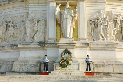 Statue in front of historical building