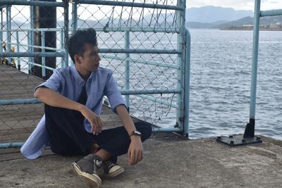 Young man looking at sea