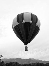 Low angle view of hot air balloon flying in sky