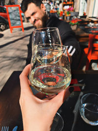 Close-up of man holding glass